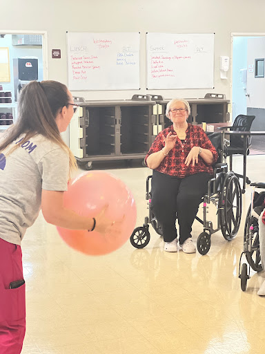 Engaging in a fun rehabilitation activity with a large exercise ball.