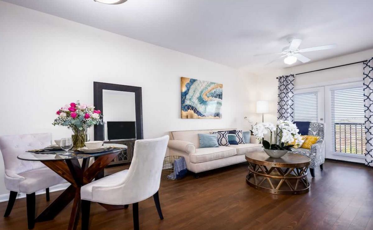 A stylish living room with contemporary decor, featuring a comfortable sofa and vibrant artwork.