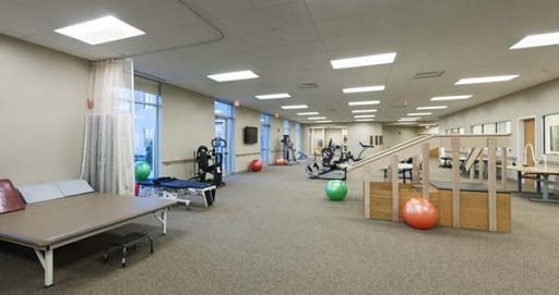 A well-equipped gym designed for fitness and rehabilitation activities.