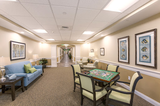 A cozy residential hallway featuring a game table and comfortable seating.