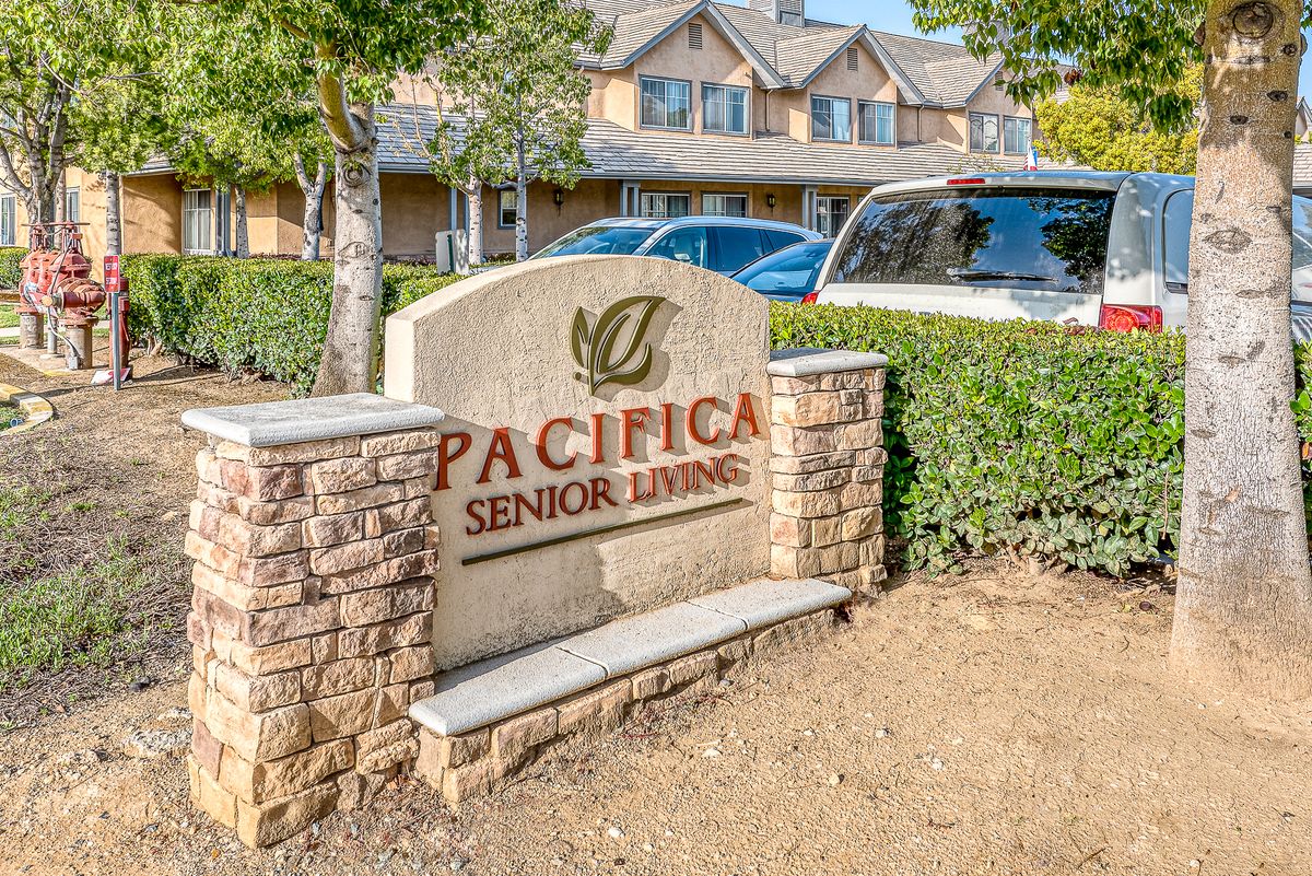 Entrance sign for Pacifica Senior Living community.