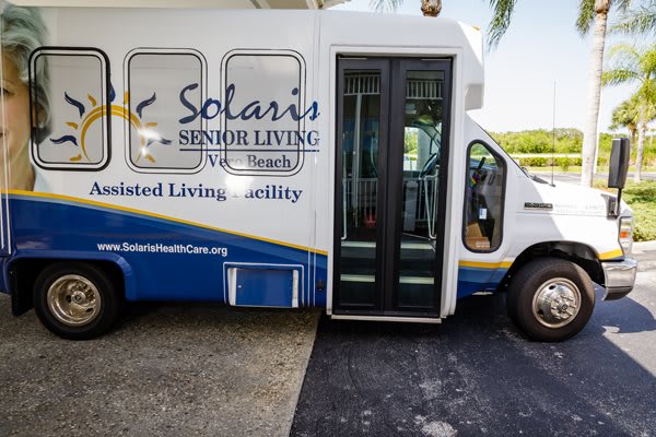 A transportation bus for Solaris Senior Living community, designed for accessibility.