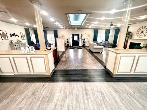 A beautifully designed modern lobby featuring elegant furniture and a spacious layout.