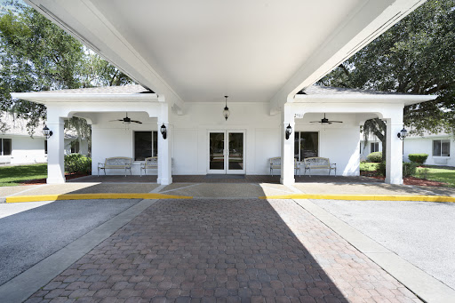 A welcoming entrance with a spacious porch and elegant architecture.