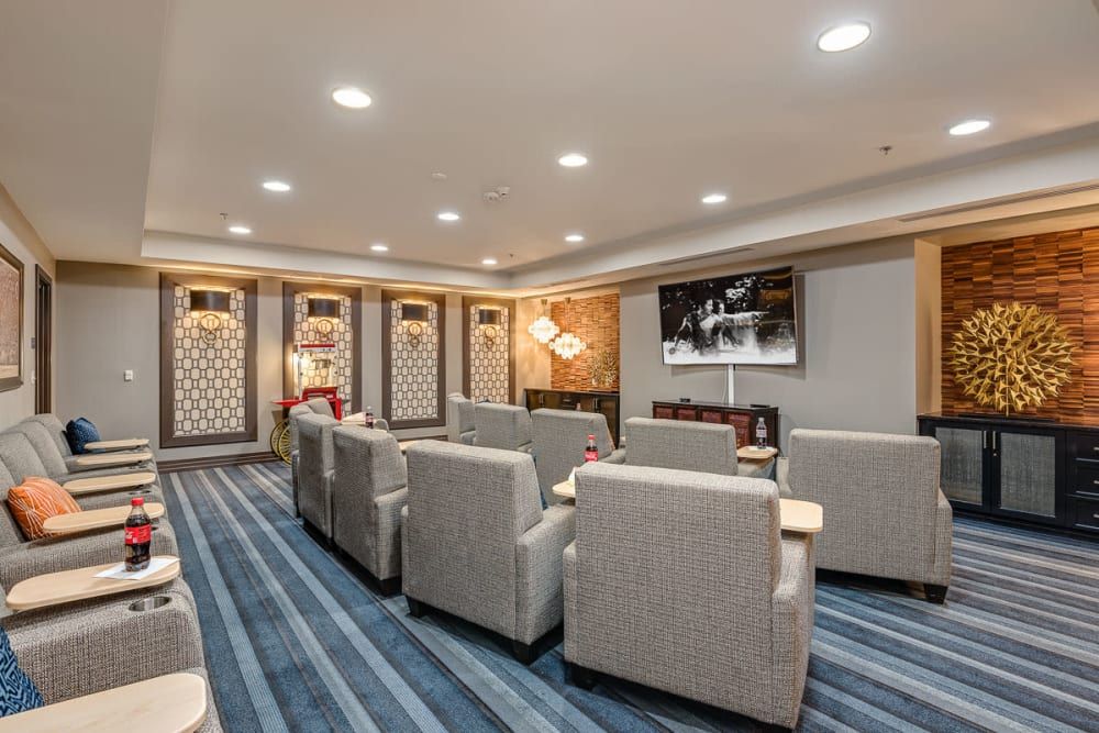 A modern lounge area with comfortable seating and a television.