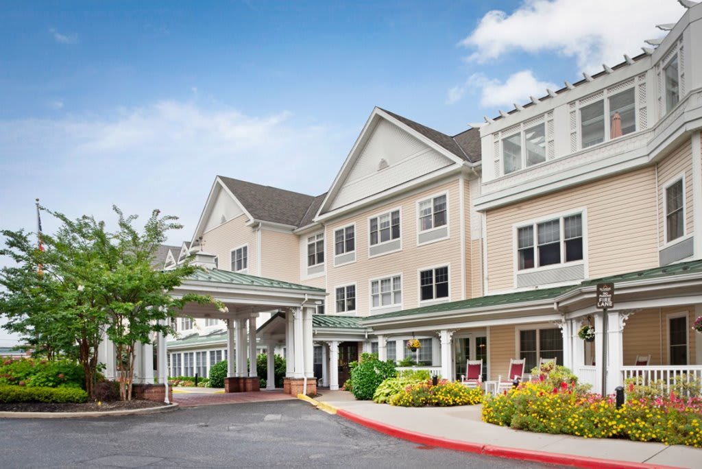The exterior view of a hotel with a welcoming entrance and well-maintained landscaping.