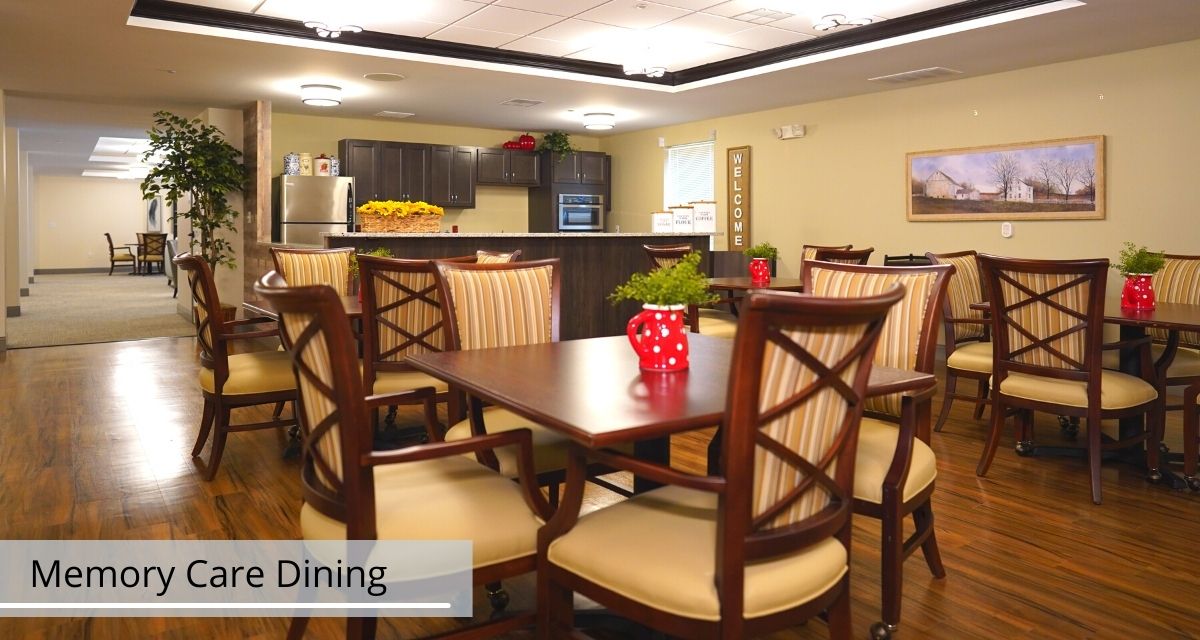 A cozy dining area with wooden furniture and a kitchen in the background.