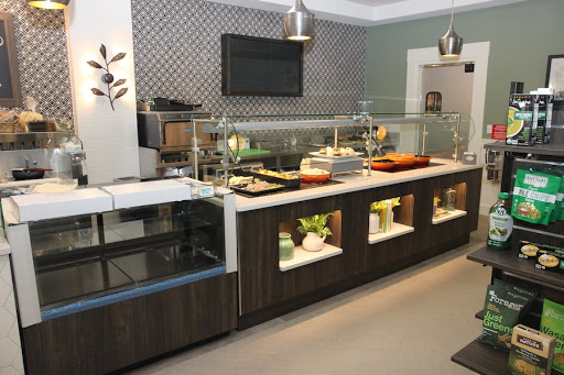 A stylish buffet setup in a modern kitchen, featuring organized food displays and contemporary design elements.