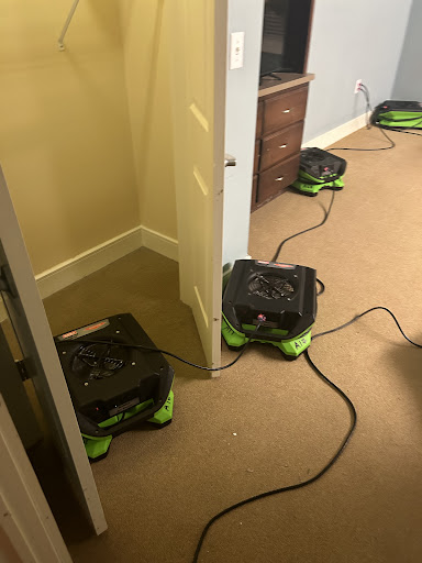 A series of air dryers set up in a room for drying purposes.