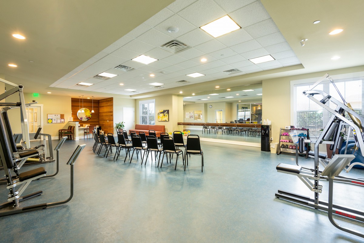 A spacious community center with arranged seating for a meeting or event.
