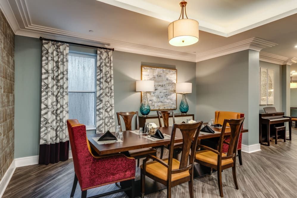 A beautifully designed dining room with elegant furnishings and warm lighting.