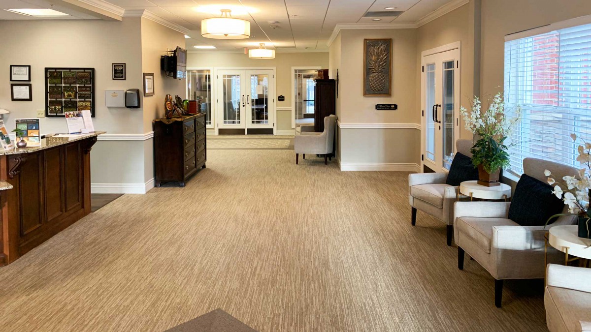 A spacious and elegantly decorated lobby with comfortable seating and warm lighting.