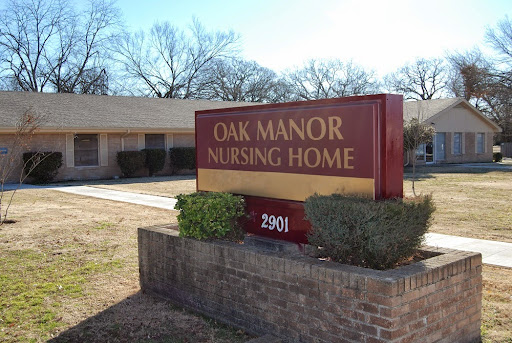 Signage for Oak Manor Nursing Home, indicating a facility dedicated to elderly care.