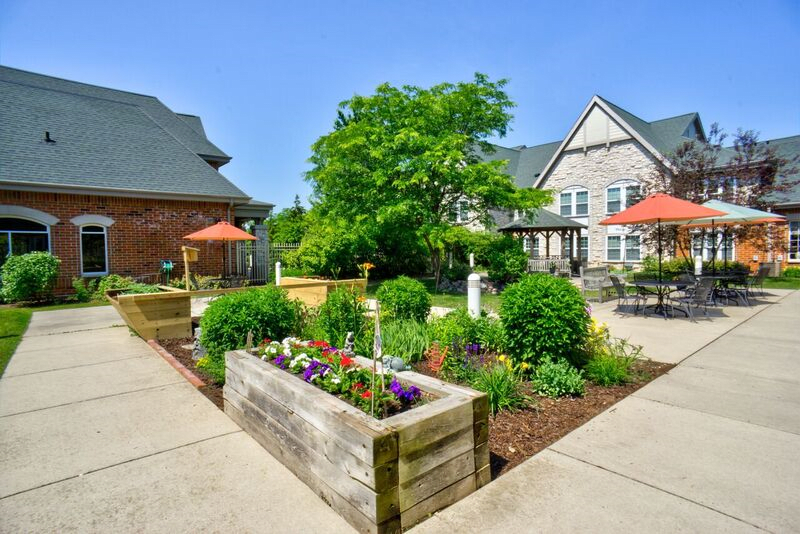 A beautifully landscaped residential garden with colorful flowers and modern architecture.