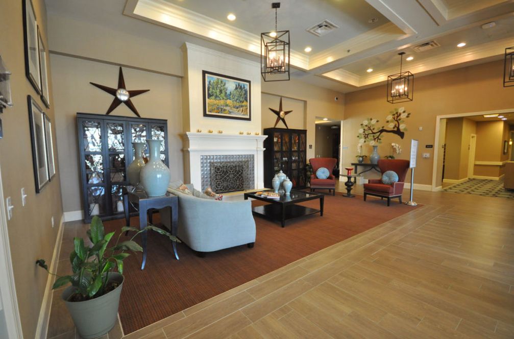 A stylish living room featuring a fireplace and comfortable seating area.