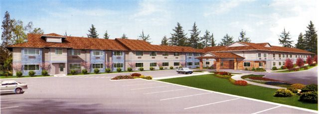 A two-story building with a parking lot in front, surrounded by trees.