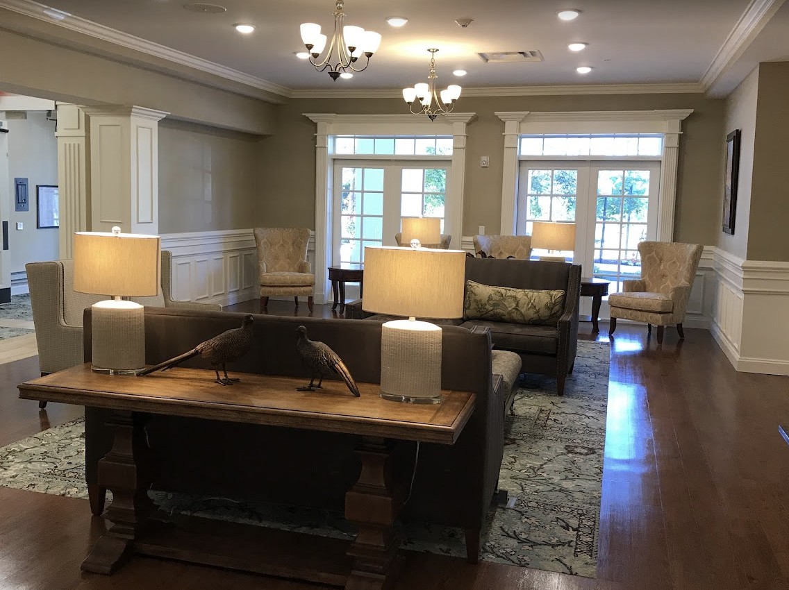 A cozy living room with elegant furniture and warm lighting.