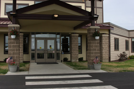 Main entrance of a building with a crosswalk.