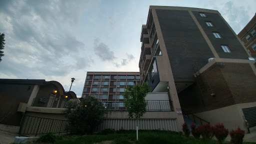 A view of modern buildings against a cloudy sky.