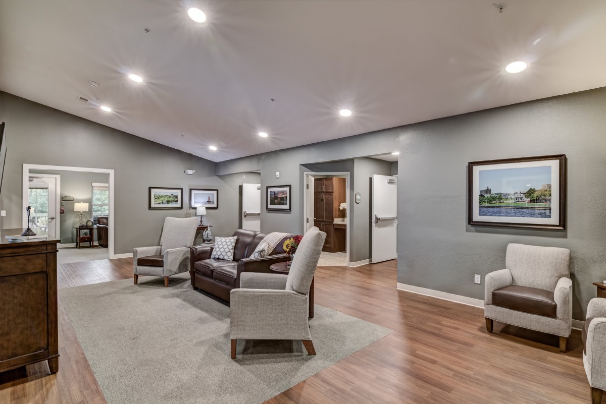 A modern living room with comfortable seating and elegant decor.