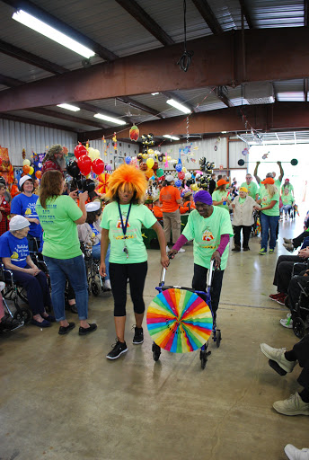 A lively community event featuring colorful costumes and joyful participants celebrating together.