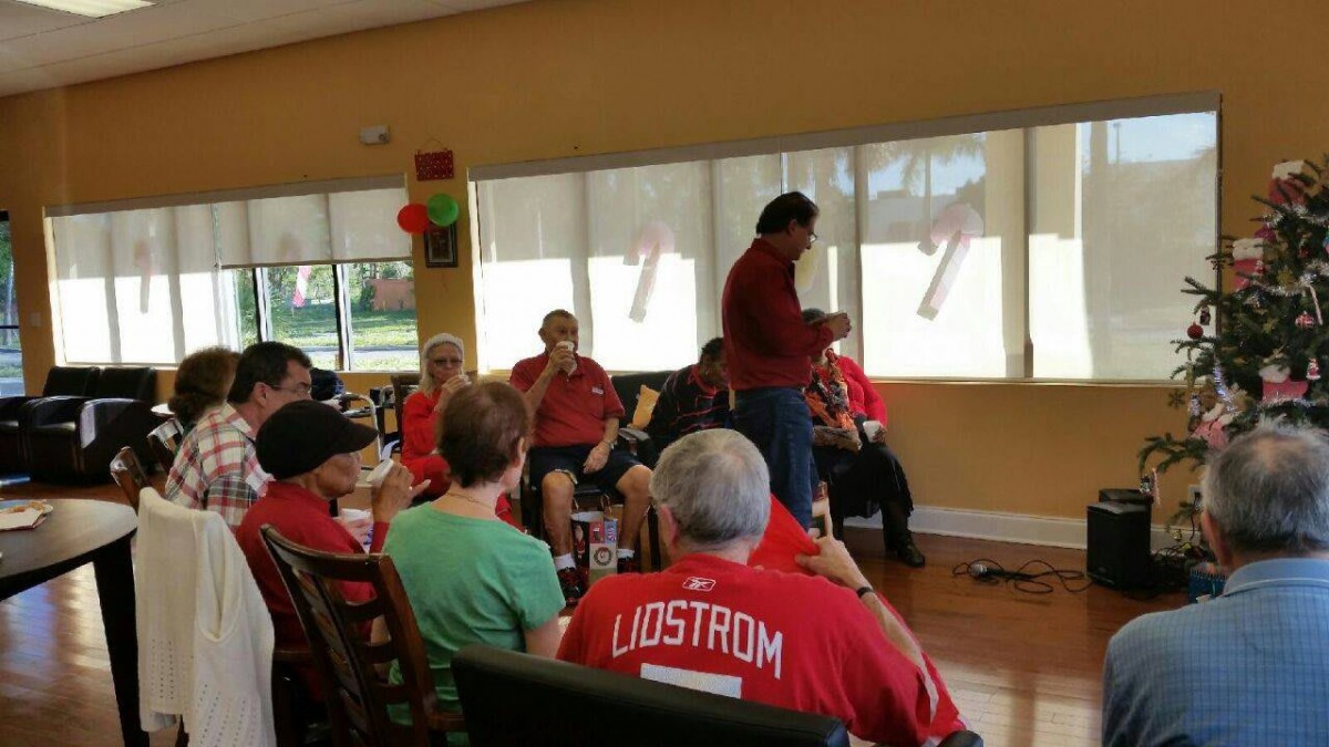 A group of people gathered indoors for a casual community event.
