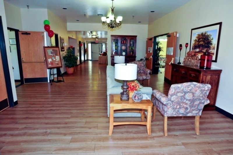 A spacious lobby area featuring comfortable seating, elegant lighting, and tasteful decorations.