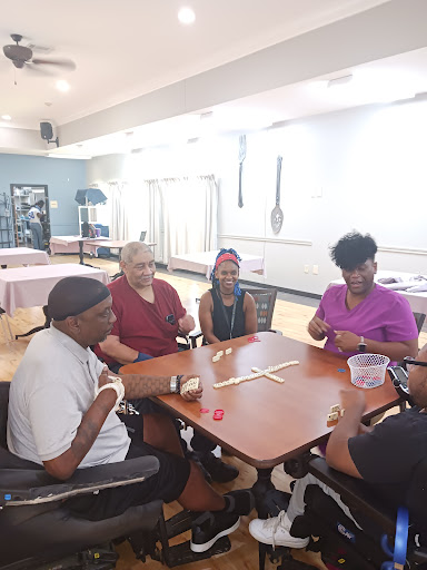 A group of individuals enjoying a game together in a bright and spacious indoor setting.