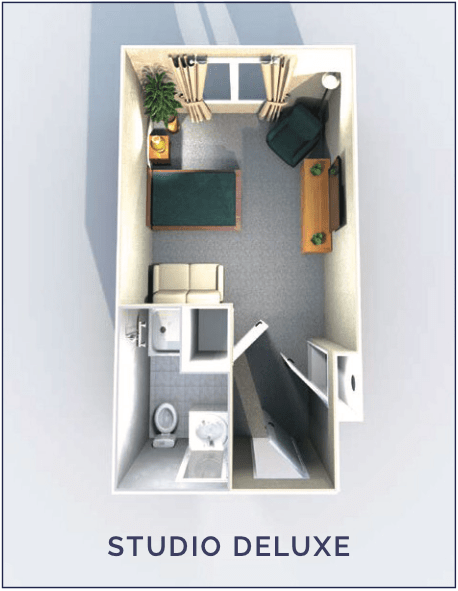 A detailed floor plan of a compact studio apartment featuring a bed, desk, and bathroom.