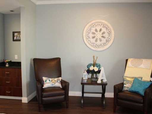 A cozy living room setup with two comfortable chairs and decorative accents.
