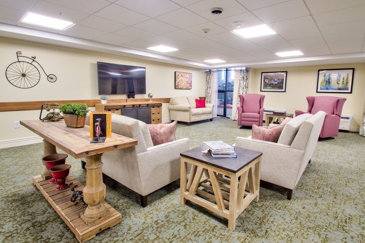 A cozy living room with comfortable seating, a large television, and stylish decor.