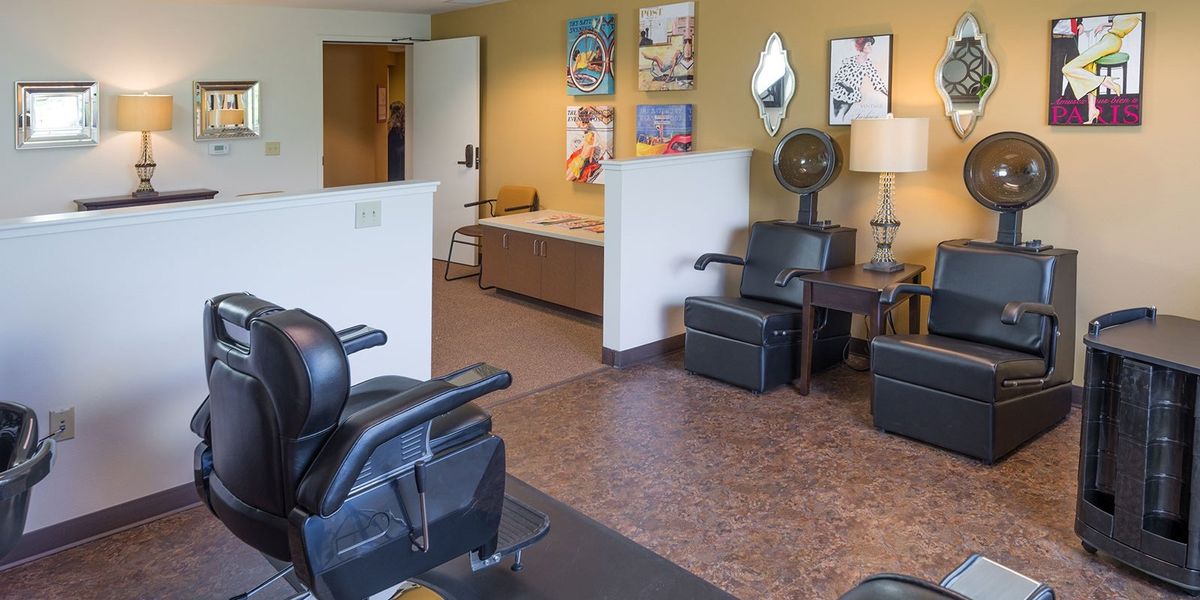 A hair salon interior featuring styling chairs and decor.
