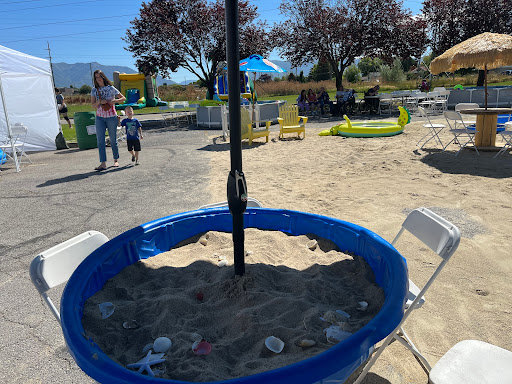 A vibrant playground scene featuring a sandbox, perfect for children to enjoy on a sunny day.