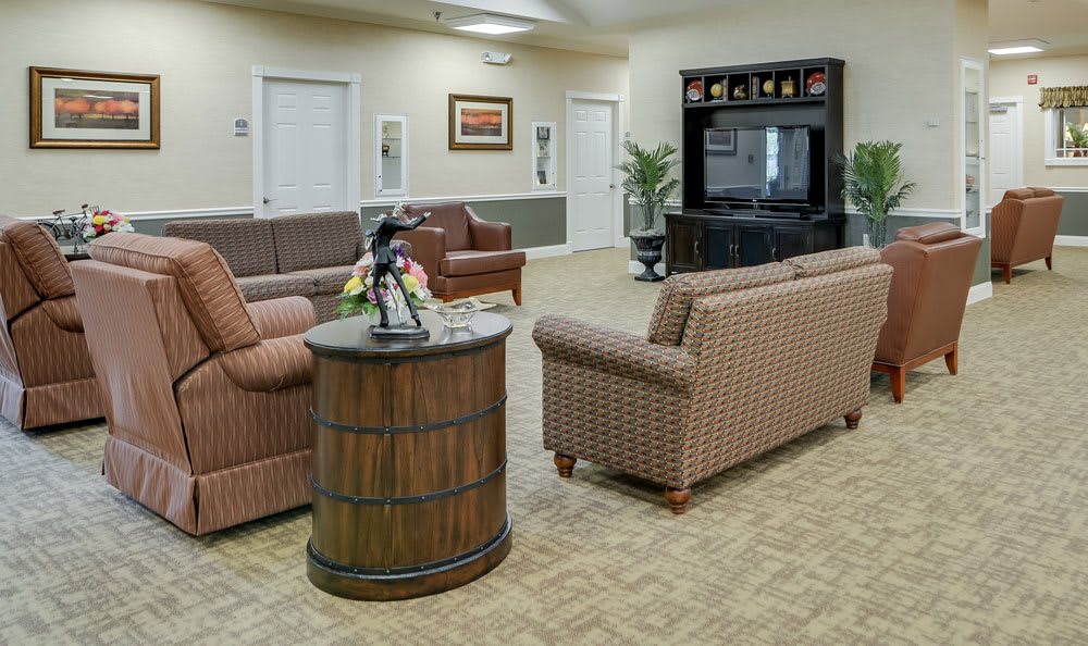 A cozy living room featuring comfortable sofas and a television.
