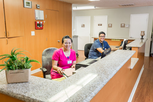 Reception staff at a welcoming office environment.