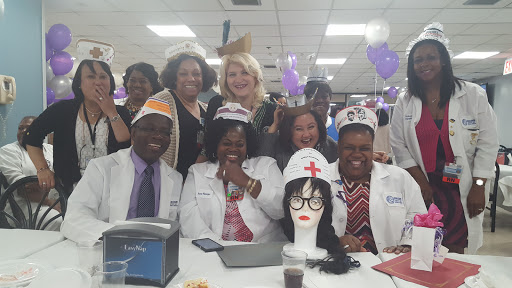 A joyful gathering of healthcare professionals celebrating together.