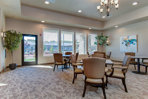 A modern lounge area featuring comfortable seating, ample natural light, and a welcoming atmosphere.
