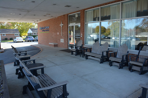 A welcoming outdoor seating area in front of a building.