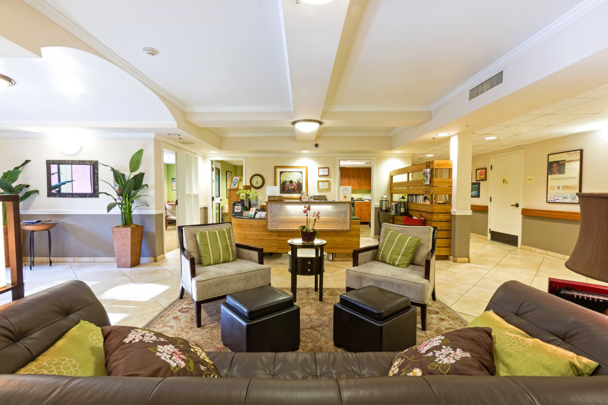 A well-decorated hotel lobby with comfortable seating and warm lighting.