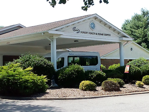 A view of a healthcare facility with well-maintained landscaping.
