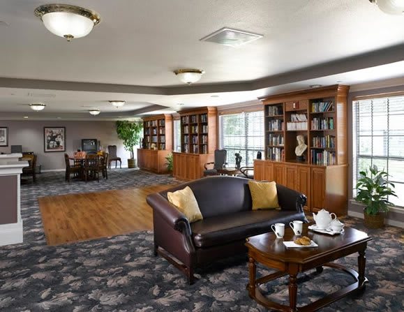 A cozy library area with comfortable seating and bookshelves, perfect for reading and relaxation.