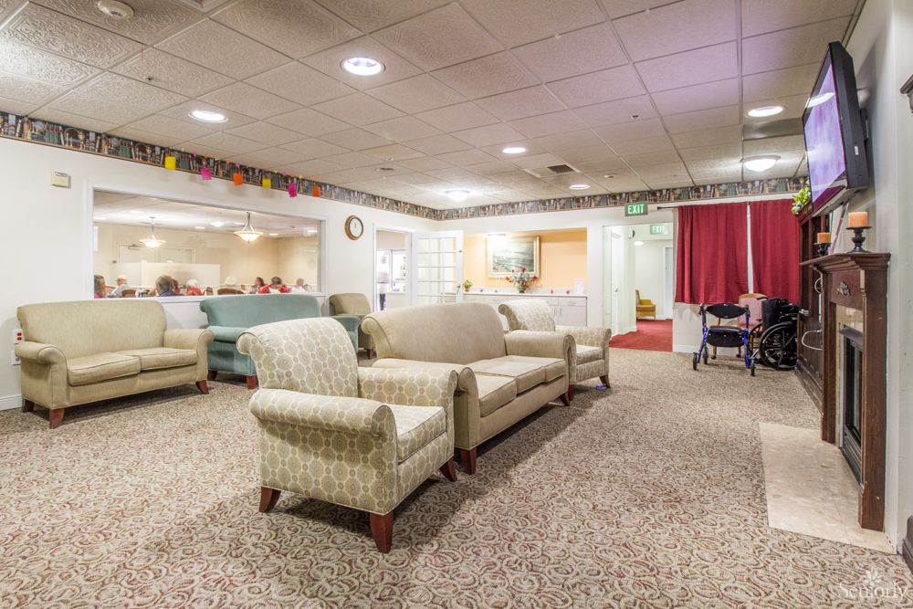 A cozy lounge area with comfortable seating and soft lighting.