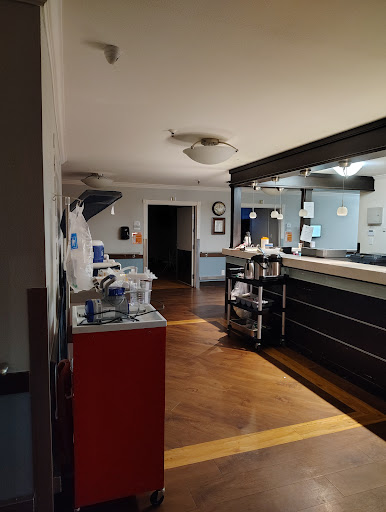 A view of a medical office reception area, featuring workstations and a calm atmosphere.