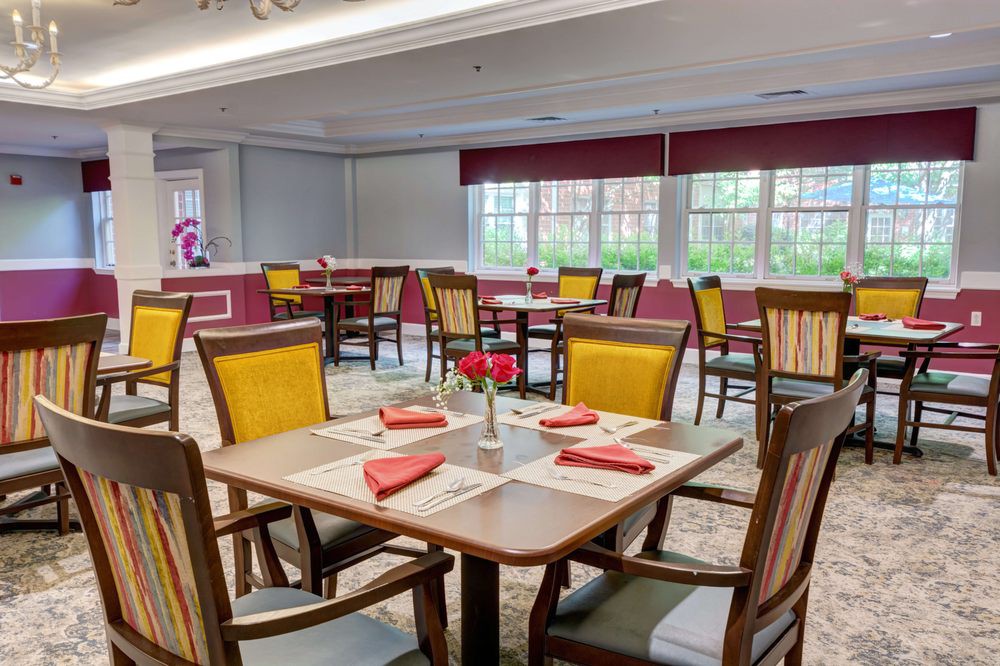 Spacious dining area with neatly set tables and bright decor.