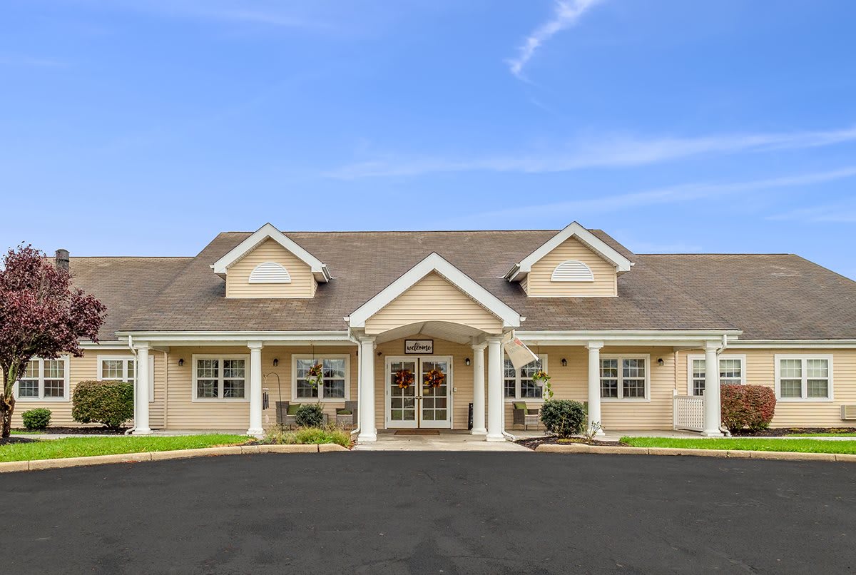 A charming suburban house with a well-maintained front yard.