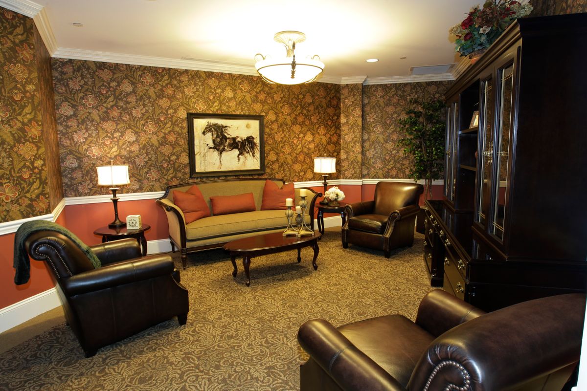 A cozy living room with elegant furniture and warm lighting.