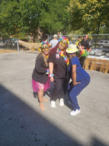 A vibrant celebration with friends, showcasing colorful outfits and joyful moments outdoors.
