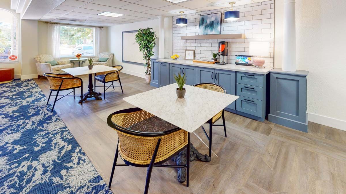 A modern dining area featuring stylish furniture and decor elements.