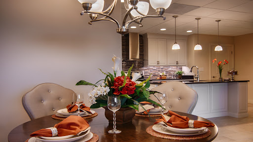 A beautifully arranged dining table with a floral centerpiece, perfect for an elegant meal.