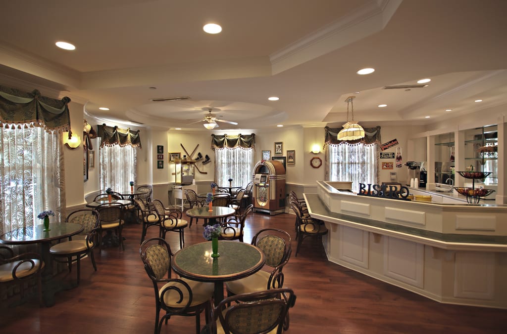 A cozy cafe interior with tables and chairs arranged neatly.
